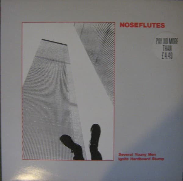 The Nose Flutes — Several Young Men Ignite Hardboard Stump
